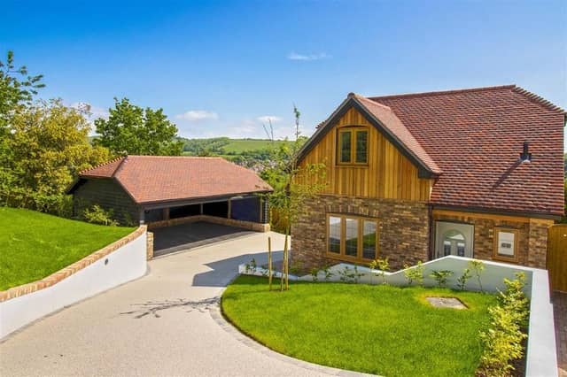 Offers in excess of £925,000 are invited for this new luxury property in Mill Lane, High Salvington. It has beautiful views over the South Downs, versatile and spacious accommodation.