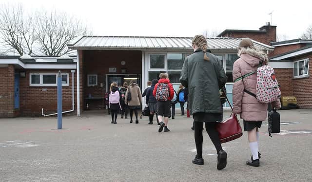 Children arrive at Manor Park School and Nursery in Knutsford, Cheshire, as pupils in England return to school for the first time in two months as part of the first stage of lockdown easing. Picture date: Monday March 8, 2021.