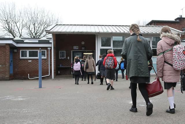 Children arrive at Manor Park School and Nursery in Knutsford, Cheshire, as pupils in England return to school for the first time in two months as part of the first stage of lockdown easing. Picture date: Monday March 8, 2021.