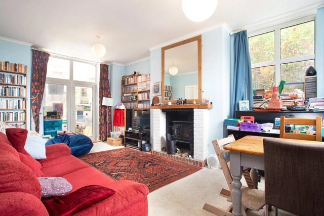 The spacious sitting room has an adjoining conservatory