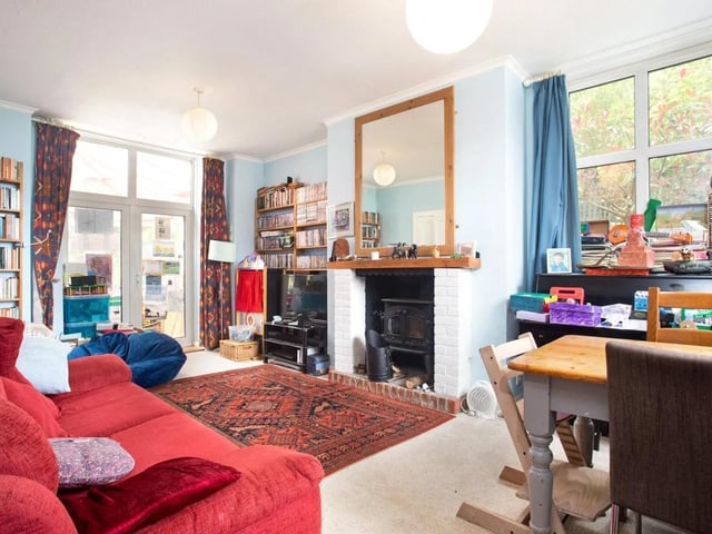 The spacious sitting room has an adjoining conservatory
