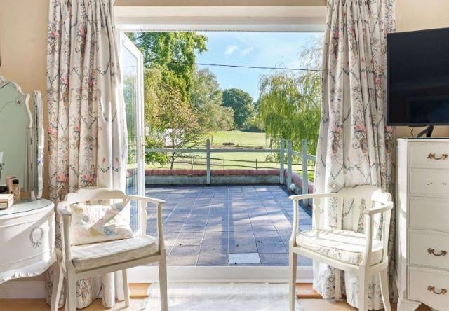 The principal bedroom has a wonderful balcony overlooking the garden. There are four other bedrooms.