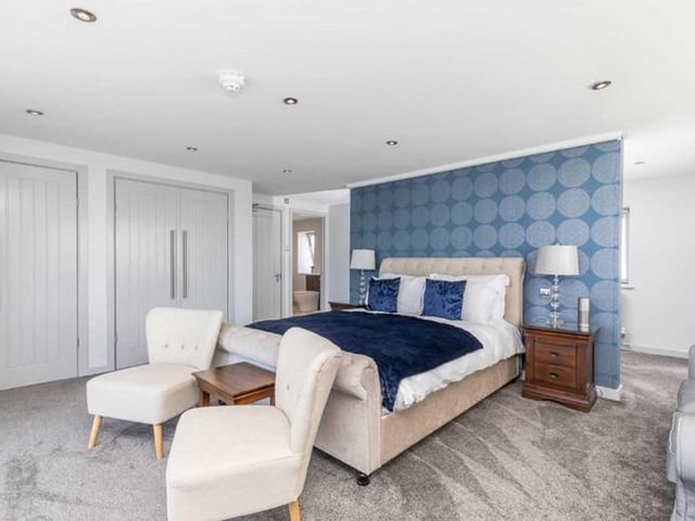 The first floor has a further double bedroom, bathroom and utility room.