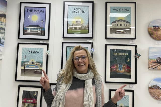 Vicky Vaughan with her latest work at Montague Gallery, which includes her vision of Worthing Lido and the Pavilion Theatre at night