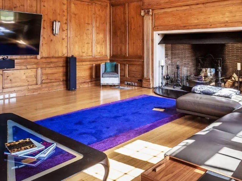 One of the wood-pannelled living rooms