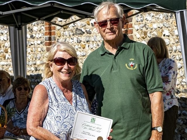 June Savory receives a Floral Art Certificate from Colin Crane at East Preston and Kingston Horticultural Society flower show
