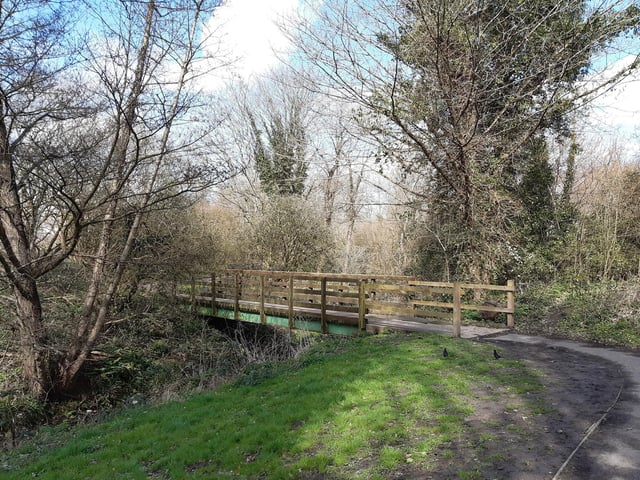 After passing through the gateway, you will cross the river on a wooden bridge