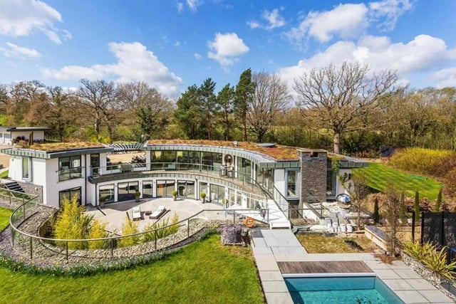 This contemporary designed house is full of home comforts, with a  cinema room, games room, gym, swimming pool with outside entertaining space, sunken courtyard, gardens and paddocks.
It is on the market for £3,000,000 with house. Covering London and The Country.