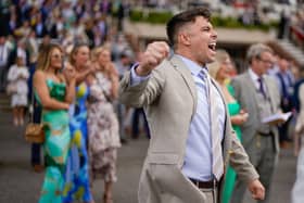 CHICHESTER, ENGLAND - AUGUST 01: A racegoer enjoys a victory at Goodwood Racecourse on August 01, 2023 in Chichester, England. (Photo by Alan Crowhurst/Getty Images):Images from the opening day of the 2023 Qatar Goodwood Festival