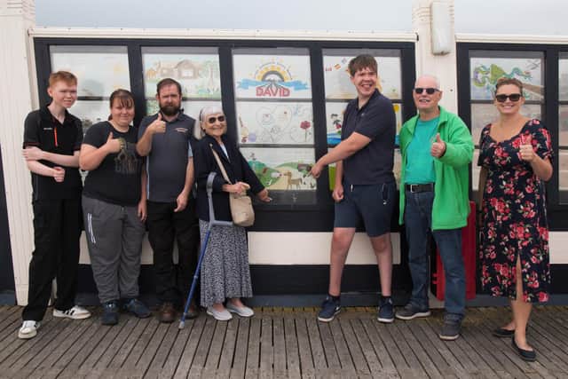 Supporter Vicki Woodard, who funded the Ferring Country Centre window on Worthing Pier, with the group from the minibus trip