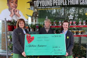 Members of Waitrose staff presented Deputy Headteacher, Ms Zoe James, with the cheque.