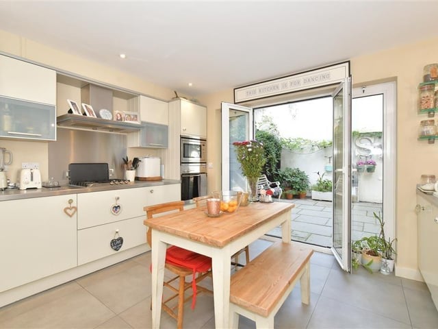 The modern kitchen has everything you need, and plenty of open space besides.