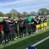 The Chichester City staff and players pay their pre-match respects following the death of Graeme Gee | Picture: Chi City FC