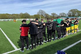 The Chichester City staff and players pay their pre-match respects following the death of Graeme Gee | Picture: Chi City FC