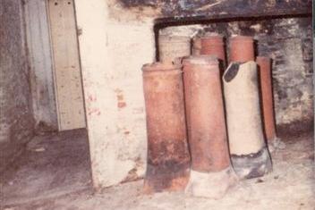 The derelict hall at Manor Cottage with chimney pots circa-1980