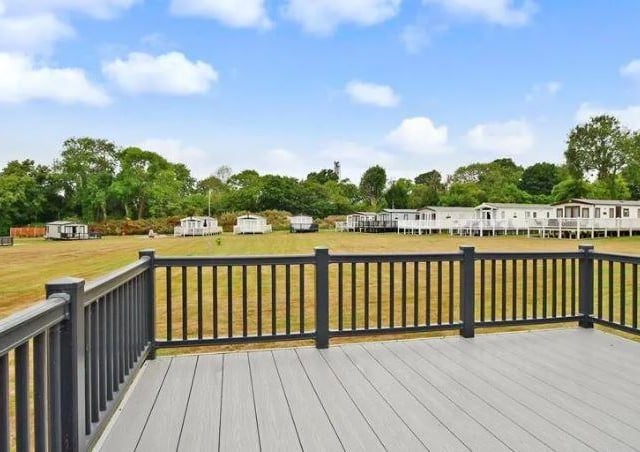 The main decking area has views across the green