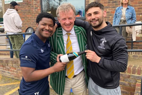 Horsham RFC chairman Richard Ordidge presenting a bottle to their two players of the match, Vince Everitt and Tyrese Makasi | Contributed photo