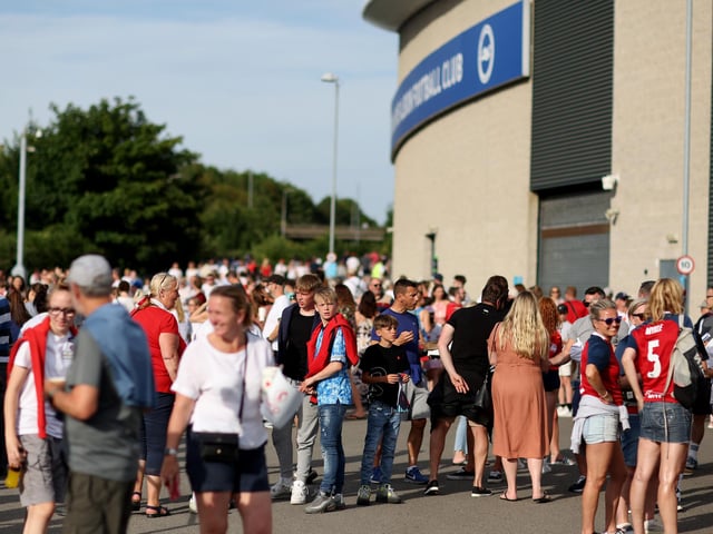 Fans arrive at the Brighton & Hove Community Stadium.