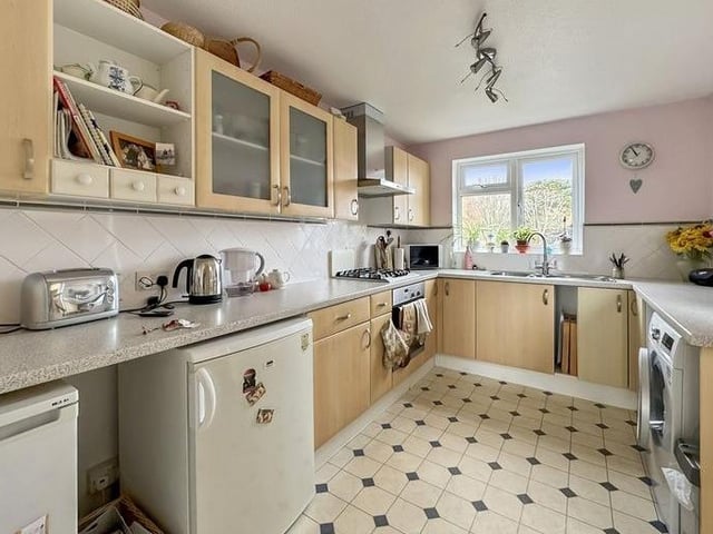 The fitted kitchen has plenty of space for appliances