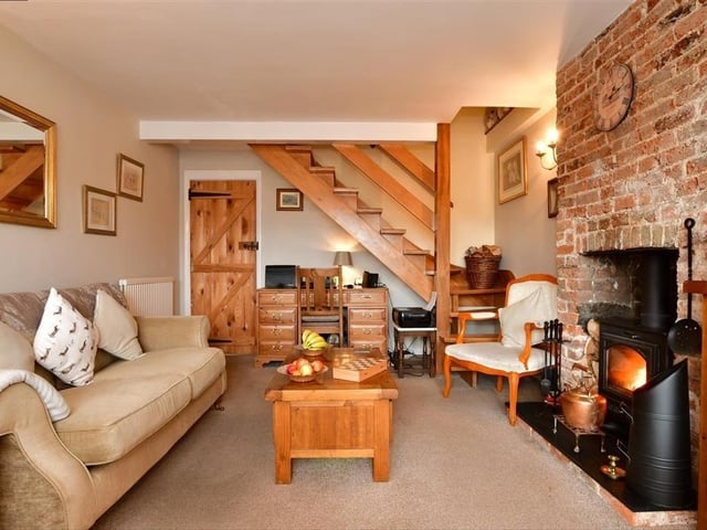 This two-bedroom cottage is on the market at £600,000 with Cubitt & West. This is a rare opportunity to own a charming riverside cottage within the desirable conservation area of historic Arundel.
