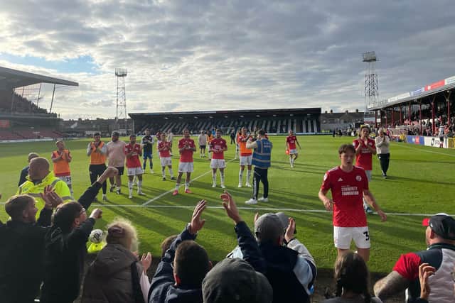 The Crawley Town players go to the fans after the 3-2 win at Grimsby Town on Saturday. Picture: Steve Herbert