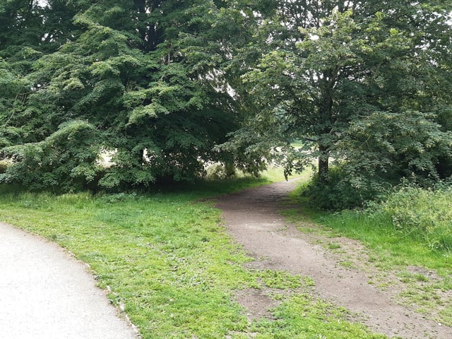 Then cross the wide road and follow the path to the right, around the back of a car park.