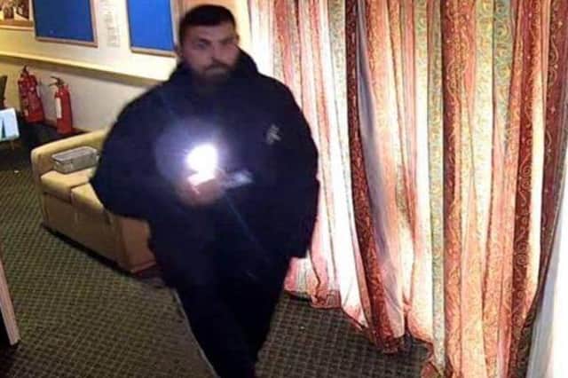 Police want to speak to this man in connection with a burglary at a former care home in Horsham