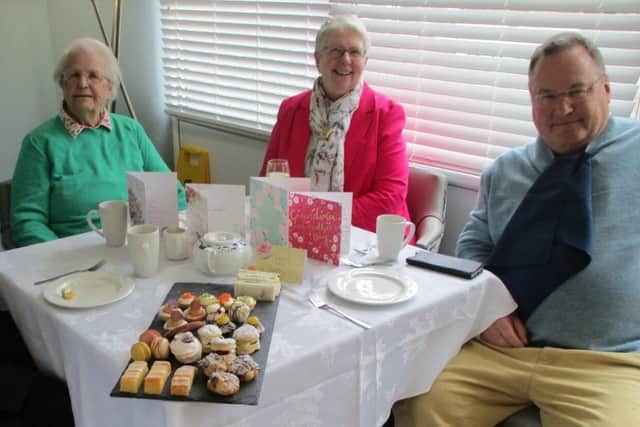 Resident and family enjoying the afternoon tea