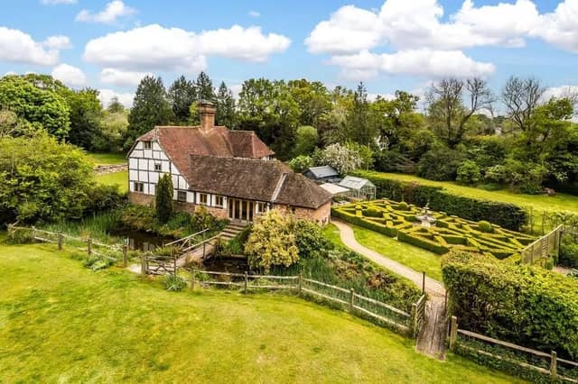 Pepper Hall is approached via electric gates across a short drive, which leads to the parking area, and the home is surrounded by formal gardens.