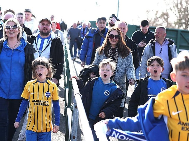 Young Brighton fans walk to the stadium  prior to the Emirates FA Cup Quarter Final