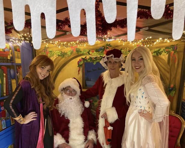 Anna, Elsa with Father Christmas and Mrs Claus