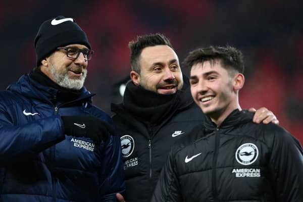 Roberto De Zerbi, Manager of Brighton & Hove Albion, interacts with Billy Gilmour and assistant head coach Andrea Maldera