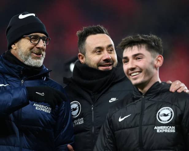 Roberto De Zerbi, Manager of Brighton & Hove Albion, interacts with Billy Gilmour and assistant head coach Andrea Maldera