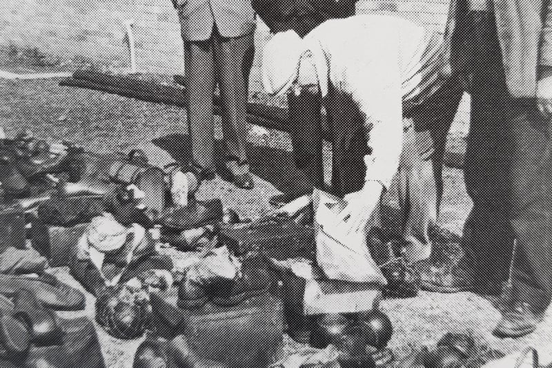 Members searching hopefully through items rescued after the fire in May 1966