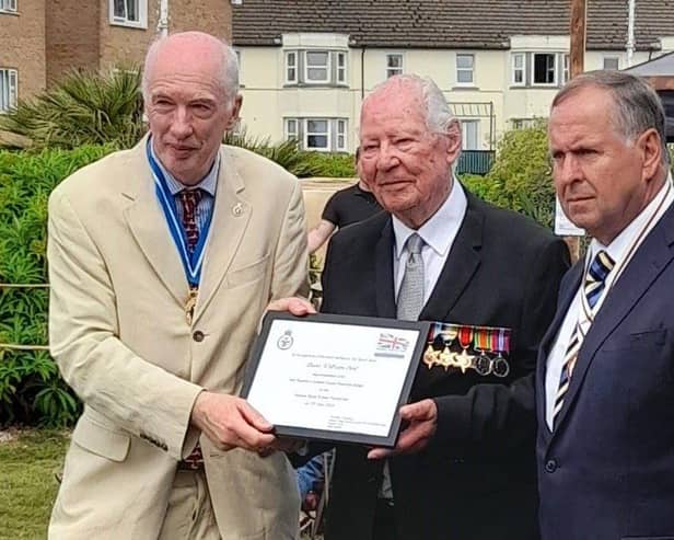 D-Day veteran Lewis Curl is awarded his Veterans Badge.