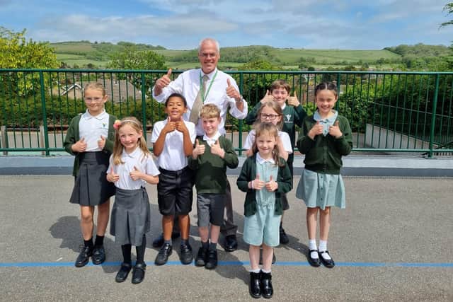 Vale School headteacher Martin Garratt celebrates the 'good' Ofsted result with pupils