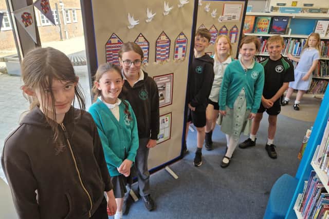 Bramber Primary School pupils with some of their work on show at Worthing Library