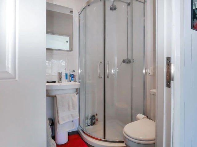 The master bedroom benefits from an en-suite shower room