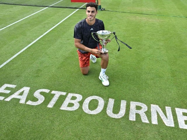 Argentina's Francisco Cerundolo poses with the trophy after his victory over US player Tommy Paul in their men's singles final tennis match at the Rothesay Eastbourne International tennis tournament in Eastbourne, southern England, on July 1, 2023. Cerundolo won in three sets. (Photo by Glyn KIRK / AFP) (Photo by GLYN KIRK/AFP via Getty Images):Action from Saturday's finals at the Rothesay tennis international at Devonshire Park, Eastbourne