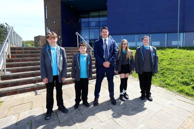 Principal Simon Addison with students.