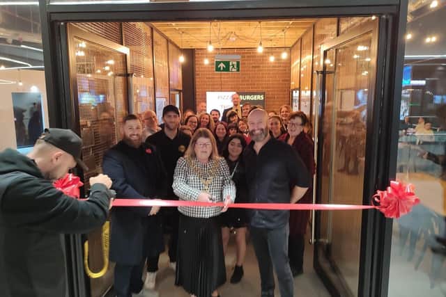 More than 50 retailers and concillors attended the official opening of a new burger and pizza place