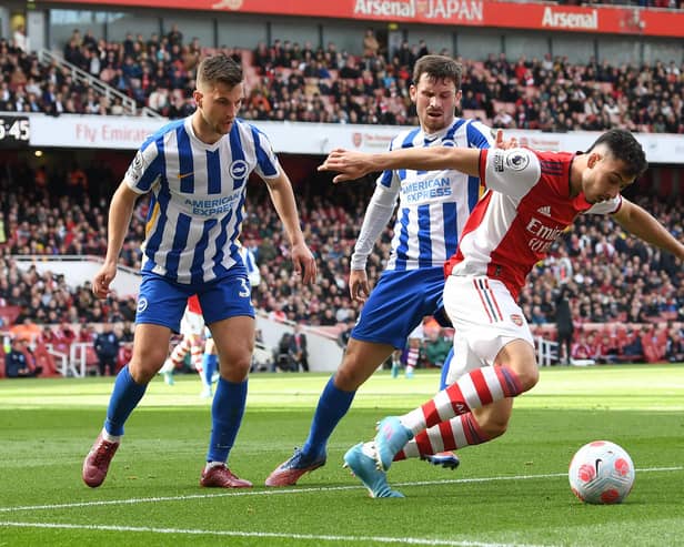 Gabriel Martinelli of Arsenal takes on Joel Veltman and Pascal Gross of Brighton during a Premier League match in April, 2022. (Photo by David Price/Arsenal FC via Getty Images)