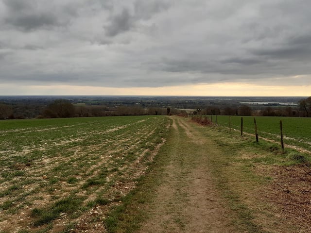 Head back through the gate and downhill, enjoying the views as you go