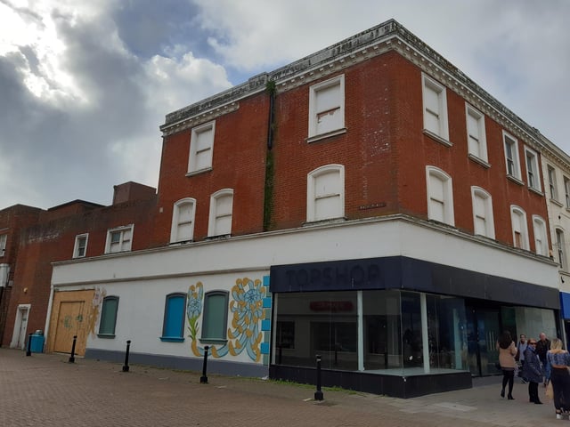 Looking rather forlorn now but once this was the side entrance to Woolworths, where the huge array of pick and mix sweets could be found and a train ran around the ceiling