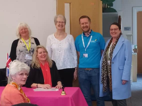 The image shows (L to R) 4SVS client Helen Roser (seated), Stella Black from the Macular Society, Mims Davies MP, volunteer Jane Aston, Dan Batchelor 4SVS Accessible Technology Specialist & Service Coordinator, and CEO Kirstie Thomas.
