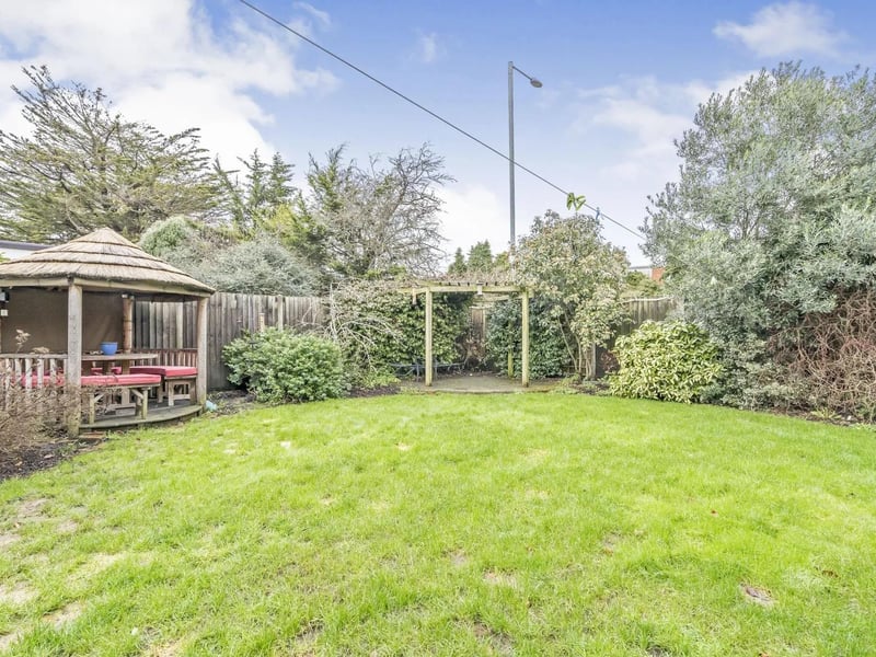 The property has gardens to the front and rear