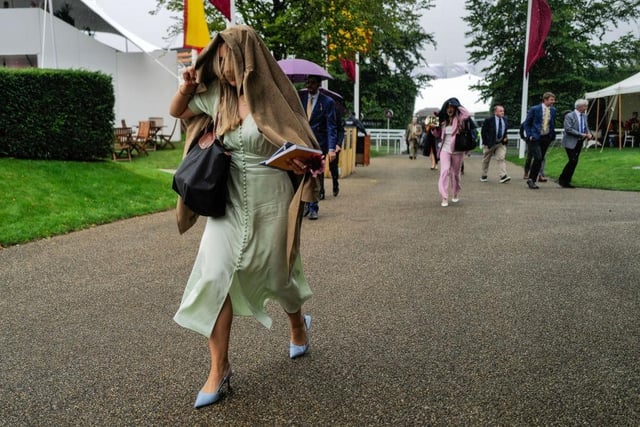 CHICHESTER, ENGLAND - AUGUST 02: A wet start to the day at Goodwood Racecourse on August 02, 2023 in Chichester, England. (Photo by Alan Crowhurst/Getty Images):Images from a murky second day at Glorious Goodwood by Alan Crowhurst of Getty and Clive Bennett