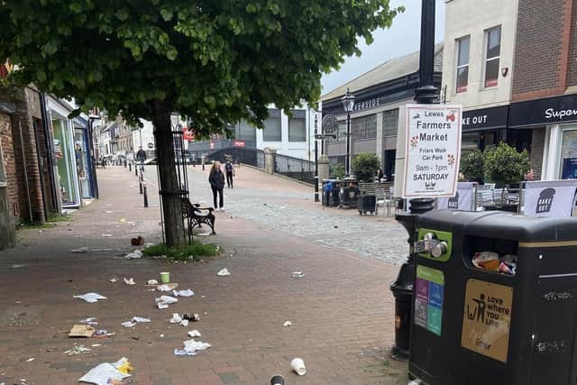 A shortage of Lewes District Council staff meant the public bins were not emptied over the weekend, leaving the streets of the East Sussex town covered in in litter.