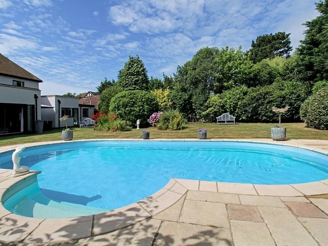 The property is on the market with Coastguards for a guide price £1,750,000. 
The house has a fully enclosed established rear garden, with a heated swimming pool.
