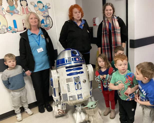 R2D2 visited kids at the Wendy House nursery at the Princess Royal Hospital in Haywards Heath